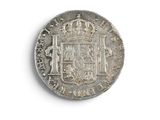 a close up of a coin with a coat of arms on it
