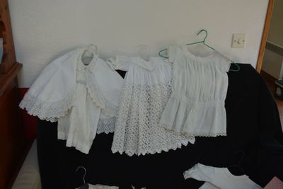 a pile of clothes that is sitting on a black suitcase