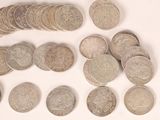 a lot of coins that are sitting on a table