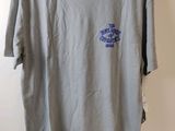 grey t - shirt with a blue logo on the chest
