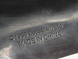 an image of a close up of a metal object on a white surface