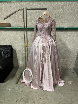 a mannequin in a dress on a stand in a room