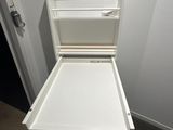 a white cabinet with a drawer on top of it