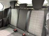 the back seats of a car with two black seats and a gray seat belt