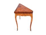 a small wooden table with a triangle shaped top