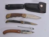 five different types of knives on a white surface