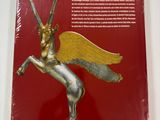 une image représentant un livre sur lequel figure l'illustration d'un ange