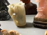 a lot of different types of statues on the table