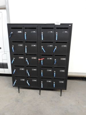 a bunch of black lockers with blue handles on them