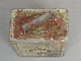 a small box with a toothbrush in it on a table
