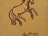 an old book with a drawing of a horse on it