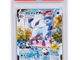the pokemon card has a picture of a white cat on it