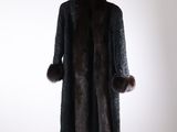 an image of a coat with a fur collar on a hanger
