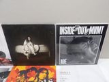 two cds are sitting on top of a table next to each other