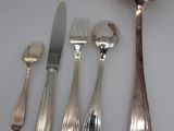 five different types of silverware on a white surface