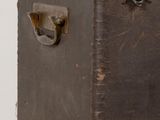 an old suitcase sitting on top of a wooden table