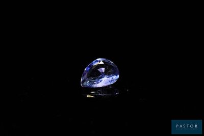 a blue diamond on a black background