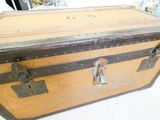 an old suitcase sitting on a table in a room
