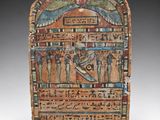an egyptian painted stone plaque depicting a scene of a man and a woman