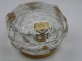 a clear glass box with a gold owl on it