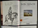 sketches of a man riding a horse in a book on a table