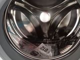 a close up of a washing machine with a lot of items inside of it