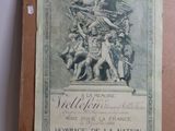 an old book with a picture of a statue on top of it