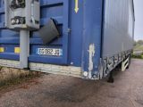 a large blue container with a metal latch on the back