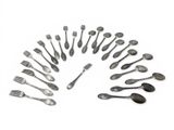 a lot of spoons and forks arranged in a circle