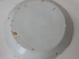 a white plate with a hole in it on a table