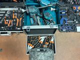 many tools in a case that are sitting on the floor