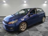 the blue car is parked in the garage on a checkered floor