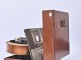 a wooden box with a record and a cd in it