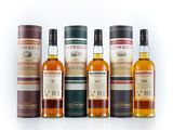 a group of six bottles of different types of whisky
