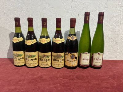 six bottles of wine are lined up on a table