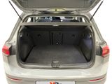 the back of a car with the trunk open and the back door open