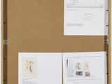 a bulletin board with a bunch of papers on it