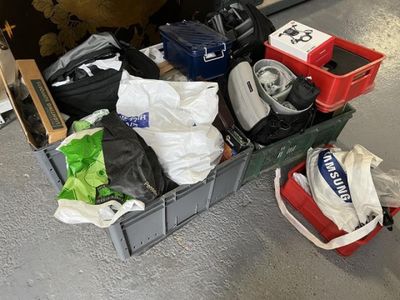 a box full of luggage sitting on the floor