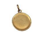 a gold coin pendant on a white background