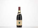 a bottle of wine sitting on top of a table