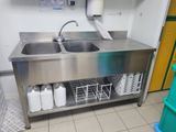a stainless steel sink in a commercial kitchen