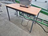 a computer sitting on top of a table in a room