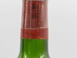 a bottle of wine that is sitting on a table