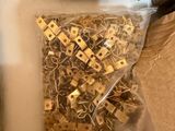 a bag of clips and a pair of scissors in a box