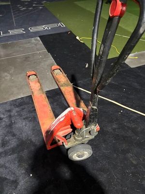 a fork lifter that is sitting on the floor