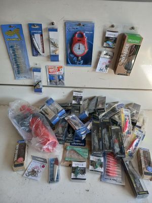 many different types of fishing lures on the counter