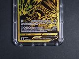 a close up of a pokemon card in a plastic case