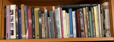 many books that are on a book shelf together