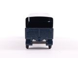 a toy truck that is sitting on a white surface