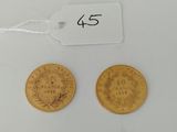 two gold coins with a price tag on them